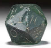 Weathered green glass twenty-sided die from the Roman Empire era