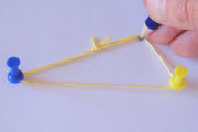 Pencil stretching the loop of string into a triangle shape.