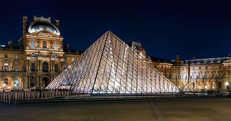 Modern glass square pyramid at the entrance of the Louvre Museum in Paris