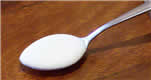 Teaspoon containing liquid to illustrate milliliters