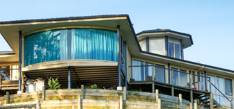 Modern suburban house with a green lawn