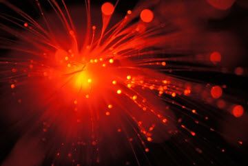 Tips of fiber optic cables glowing with colorful light