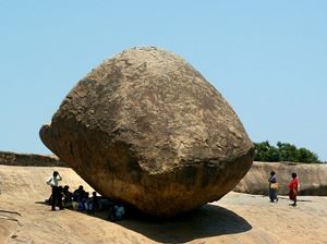 Large boulder balanced precariously on a tiny point of another rock